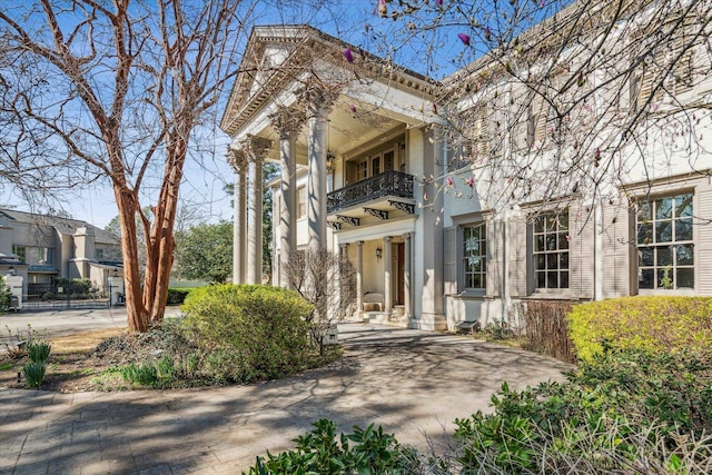 view of front of home with a balcony