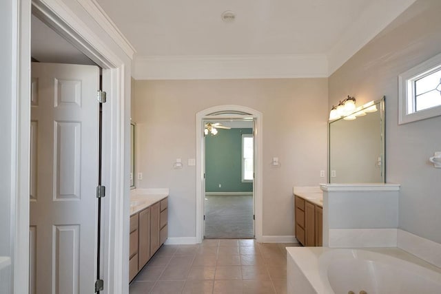 bathroom featuring ceiling fan, a bathing tub, vanity, and tile flooring