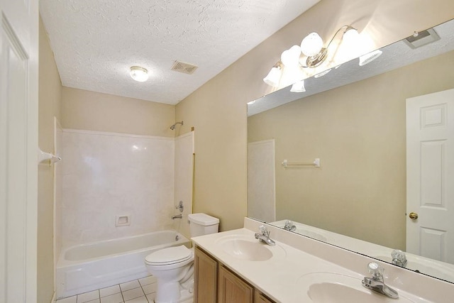 full bathroom with vanity with extensive cabinet space, toilet, tile flooring, bathing tub / shower combination, and dual sinks