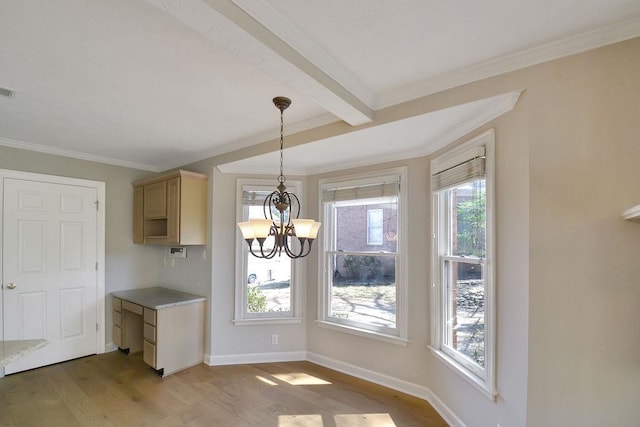 unfurnished dining area with a wealth of natural light, beamed ceiling, hardwood / wood-style floors, and a notable chandelier