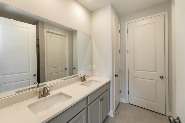 bathroom with vanity and tile patterned floors