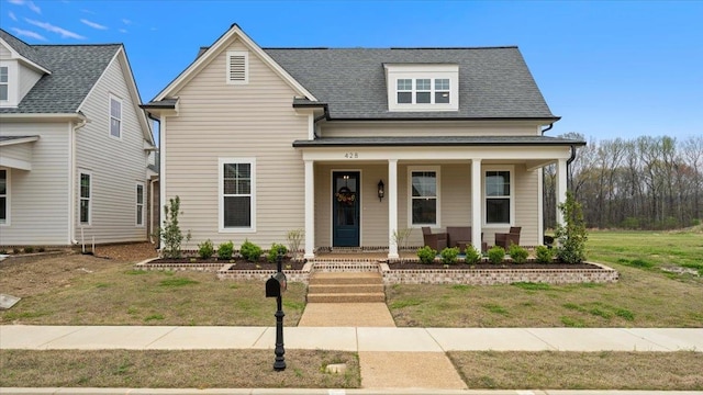 view of front of house with a front lawn and a porch