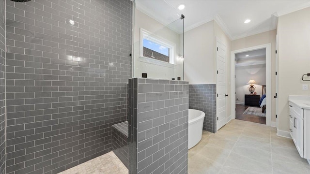 bathroom featuring plus walk in shower, crown molding, vanity, tile walls, and tile floors