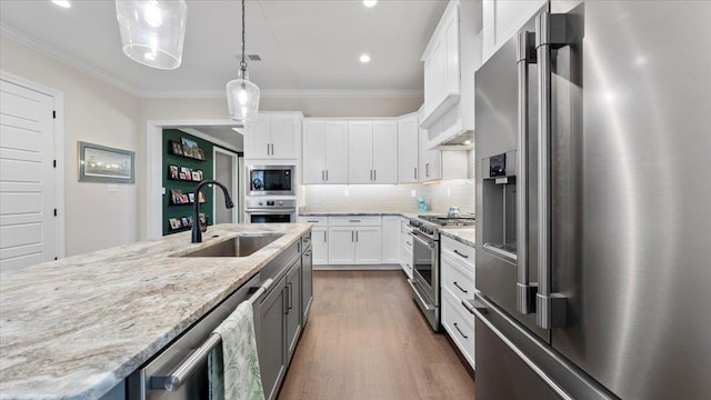 kitchen featuring pendant lighting, dark hardwood / wood-style flooring, white cabinets, backsplash, and high quality appliances