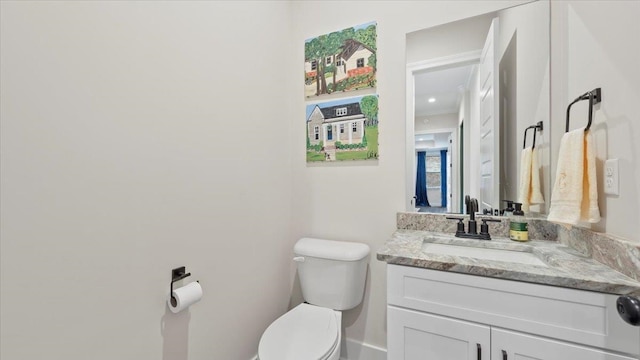 bathroom featuring toilet and oversized vanity