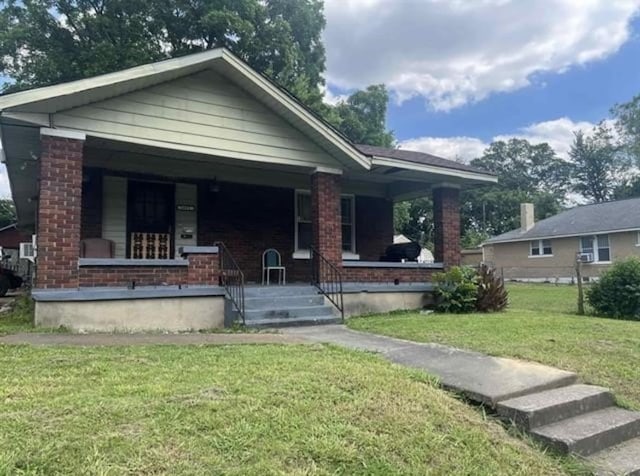 view of front of home with a front lawn and covered porch