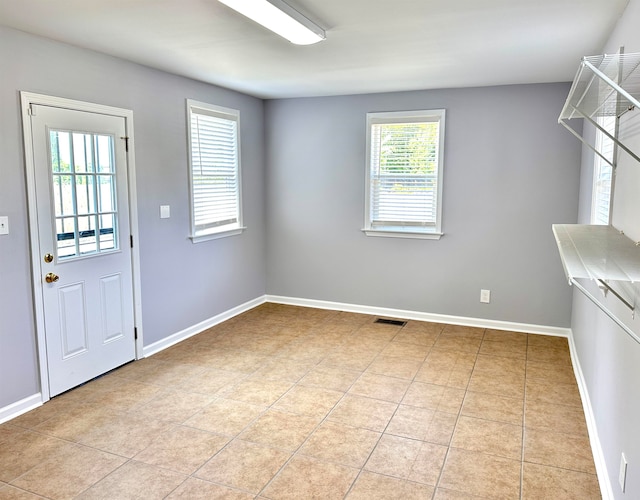 interior space featuring light tile floors