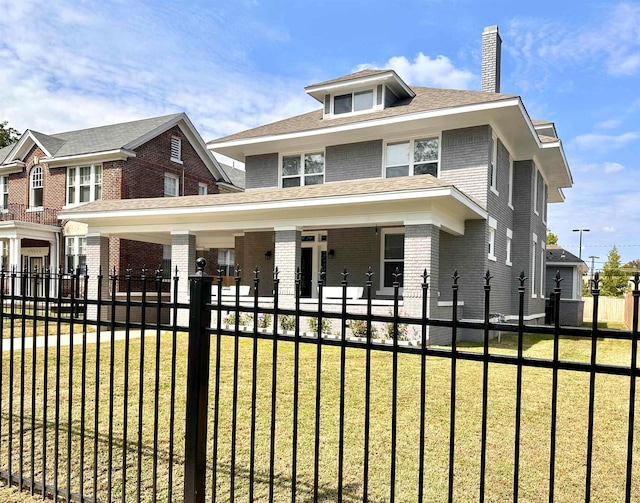 view of front of home featuring a front lawn