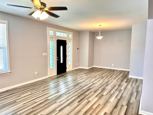 entrance foyer featuring ceiling fan and light hardwood / wood-style flooring