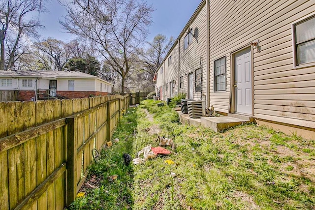 view of yard featuring central AC