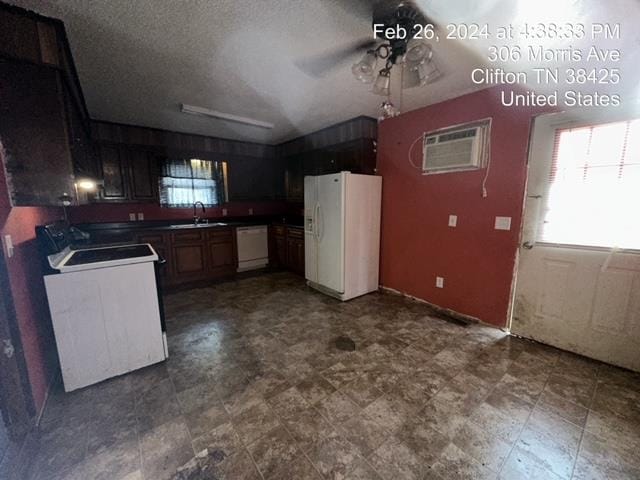 kitchen featuring white appliances, ceiling fan, sink, tile floors, and a textured ceiling