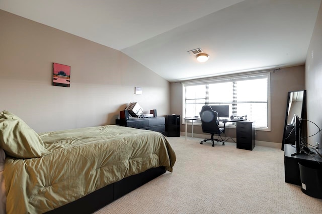 bedroom featuring light carpet and lofted ceiling