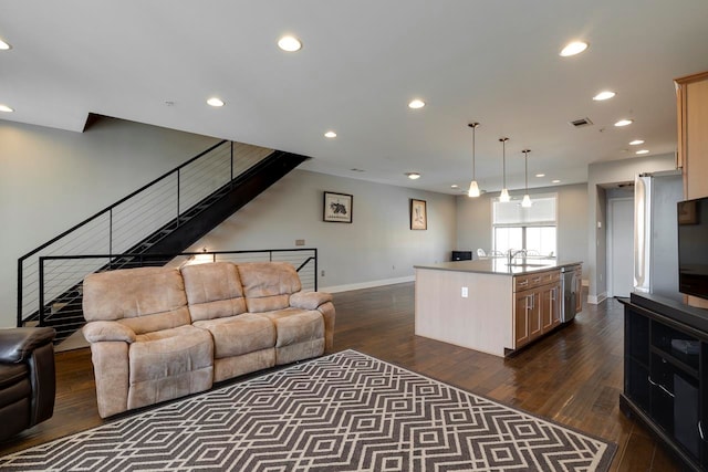 living room with sink and dark hardwood / wood-style flooring