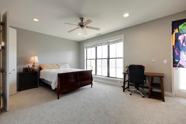 bedroom with light carpet and ceiling fan