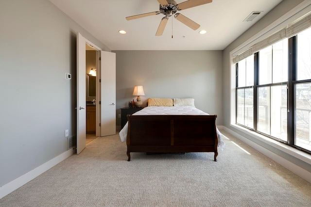 bedroom featuring light colored carpet and ceiling fan