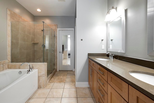 bathroom with vanity, independent shower and bath, and tile patterned floors