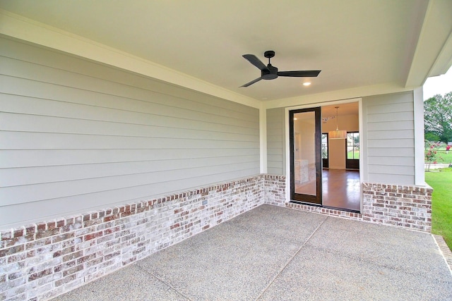 doorway to property featuring a patio area and ceiling fan