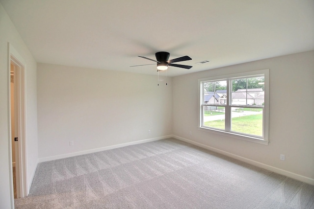 empty room with light carpet and ceiling fan