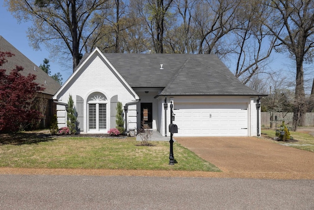 view of front of home with a garage, brick siding, a shingled roof, concrete driveway, and a front yard