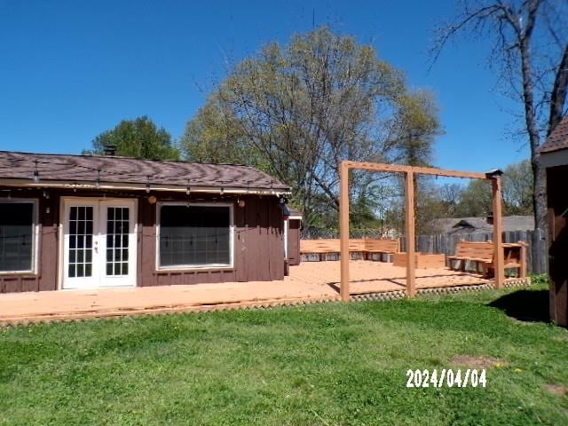 view of yard featuring french doors