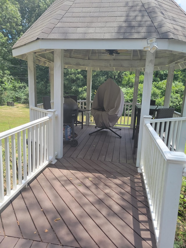 wooden terrace with a grill, a gazebo, and ceiling fan