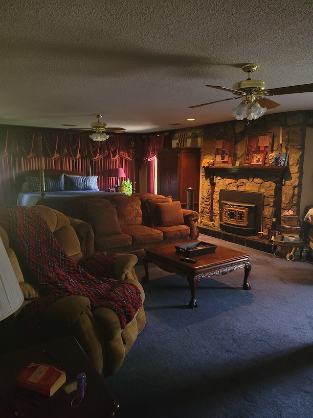 carpeted living room with a fireplace, a textured ceiling, and ceiling fan