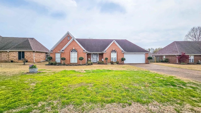 view of front facade featuring a front lawn and a garage