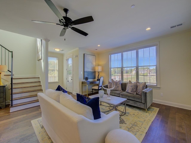 living room with ornamental molding, ceiling fan, and hardwood / wood-style floors