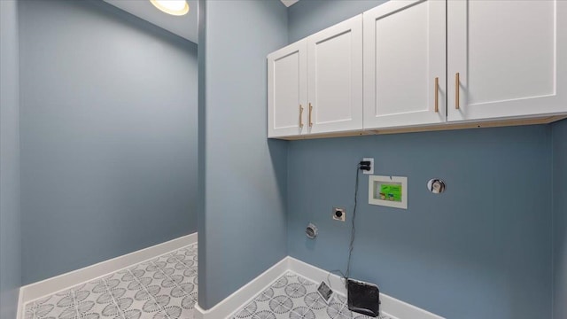 1072 Bruce St, Memphis, TN 38104 - laundry area featuring light tile floors, washer hookup, hookup for an electric dryer, and cabinets