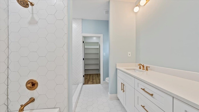 1072 Bruce St, Memphis, TN 38104 - bathroom with tile flooring, toilet, a tile shower, and vanity