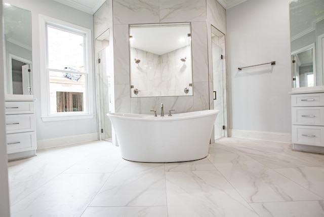 bathroom with tile patterned flooring, a bath, ornamental molding, and tile walls