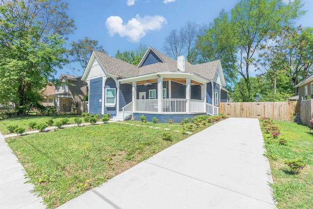 view of front of home with a front lawn and covered porch