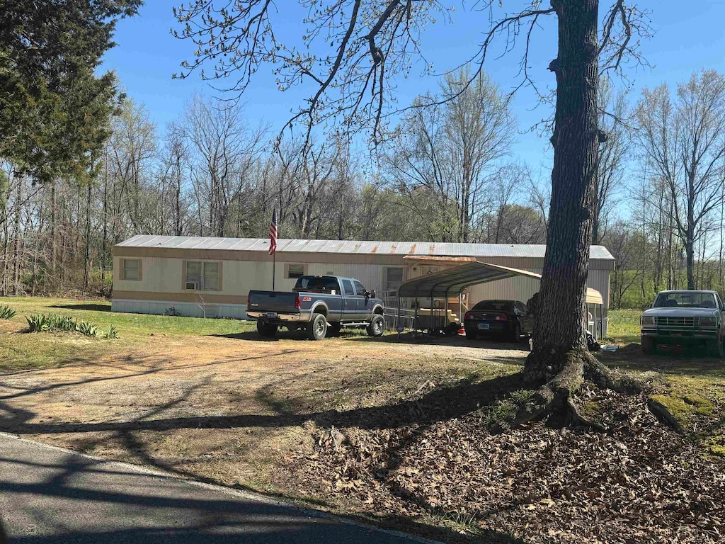 view of property exterior featuring a carport