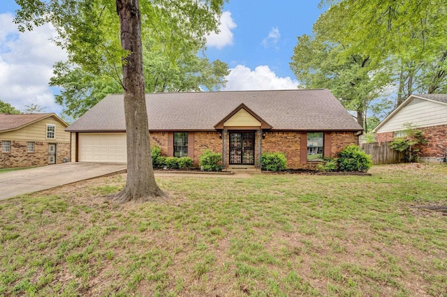 ranch-style home with a garage and a front lawn