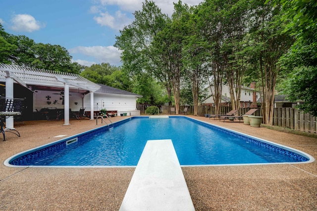 view of swimming pool featuring a patio, a diving board, and a pergola