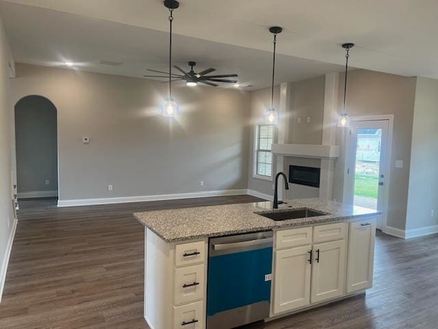 kitchen with white cabinetry, dark wood-type flooring, ceiling fan, stainless steel dishwasher, and sink