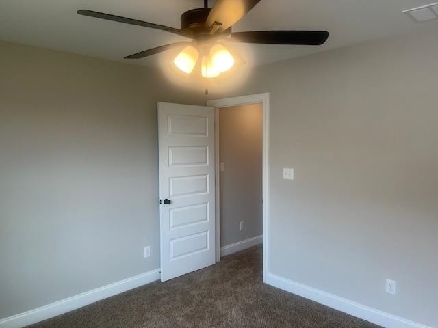 carpeted empty room with ceiling fan