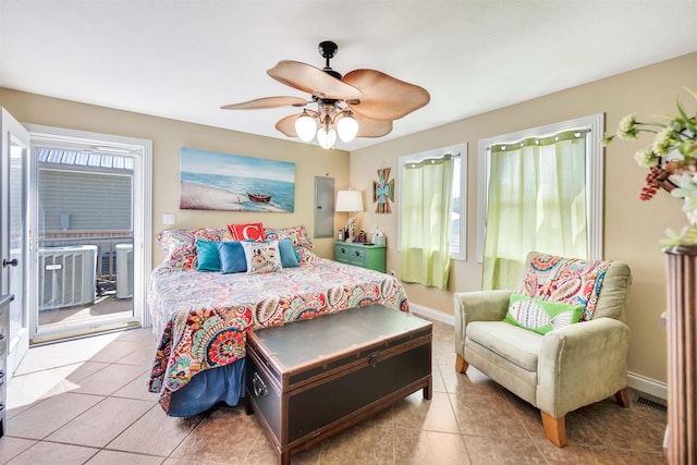 bedroom featuring ceiling fan, tile floors, access to exterior, and multiple windows