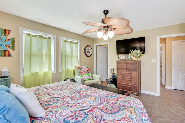 bedroom featuring tile floors and ceiling fan