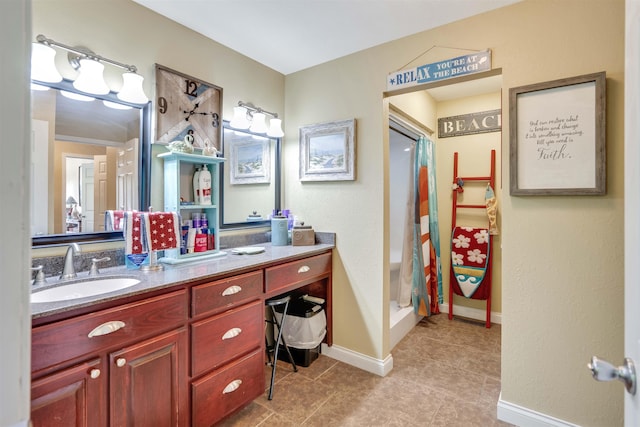 bathroom featuring tile floors and vanity