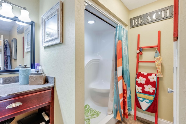 bathroom with a shower with curtain and vanity