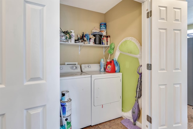 clothes washing area with washer hookup, washing machine and dryer, and light tile floors