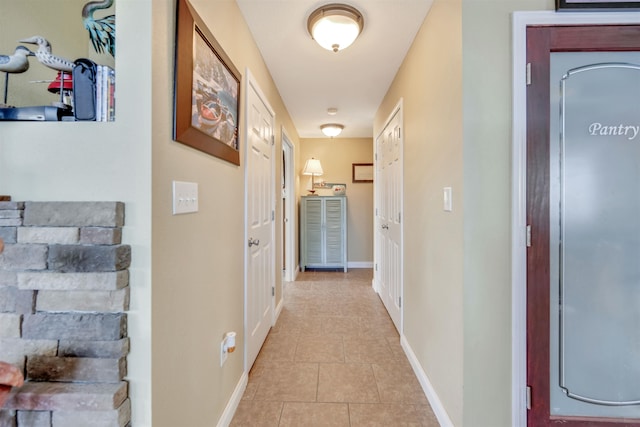 hall with tile flooring