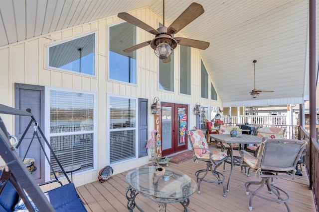 wooden deck featuring french doors and ceiling fan