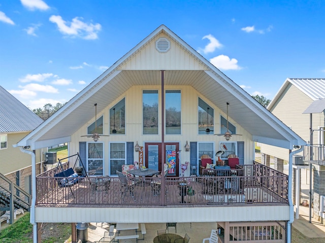 rear view of house with a wooden deck