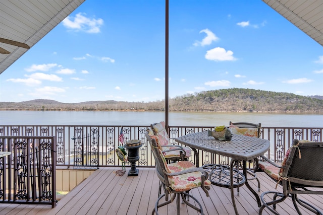 wooden deck featuring a water view