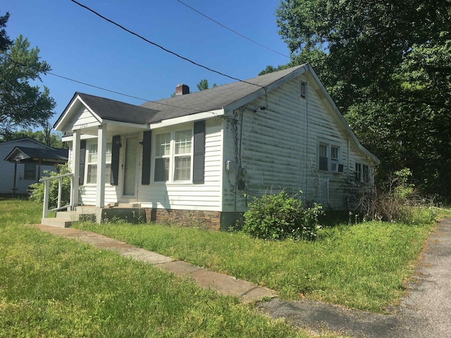 2965 Lotus Rd, Memphis, TN 38109 - view of home's exterior featuring a lawn