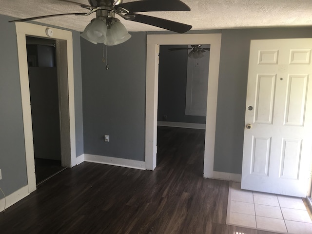 2965 Lotus Rd, Memphis, TN 38109 - empty room featuring tile floors, ceiling fan, and a textured ceiling