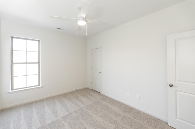 carpeted empty room with ceiling fan