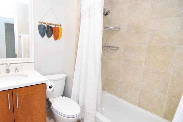 full bathroom with vanity, toilet, and shower / bath combo with shower curtain